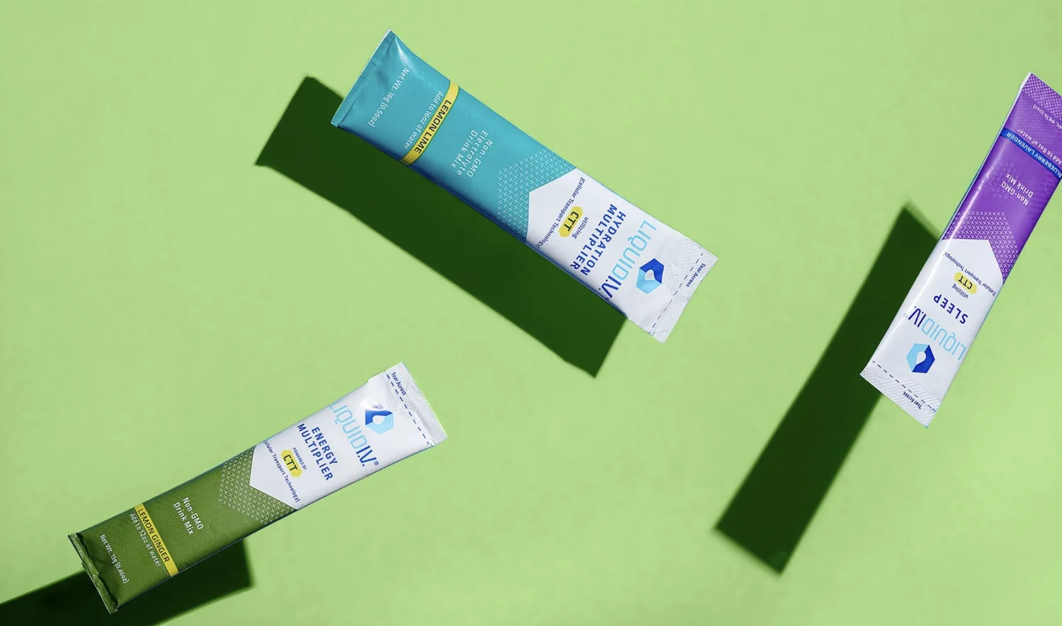 Liquid I.V. Hydration, Energy and Sleep Multiplier sticks on a green ground.